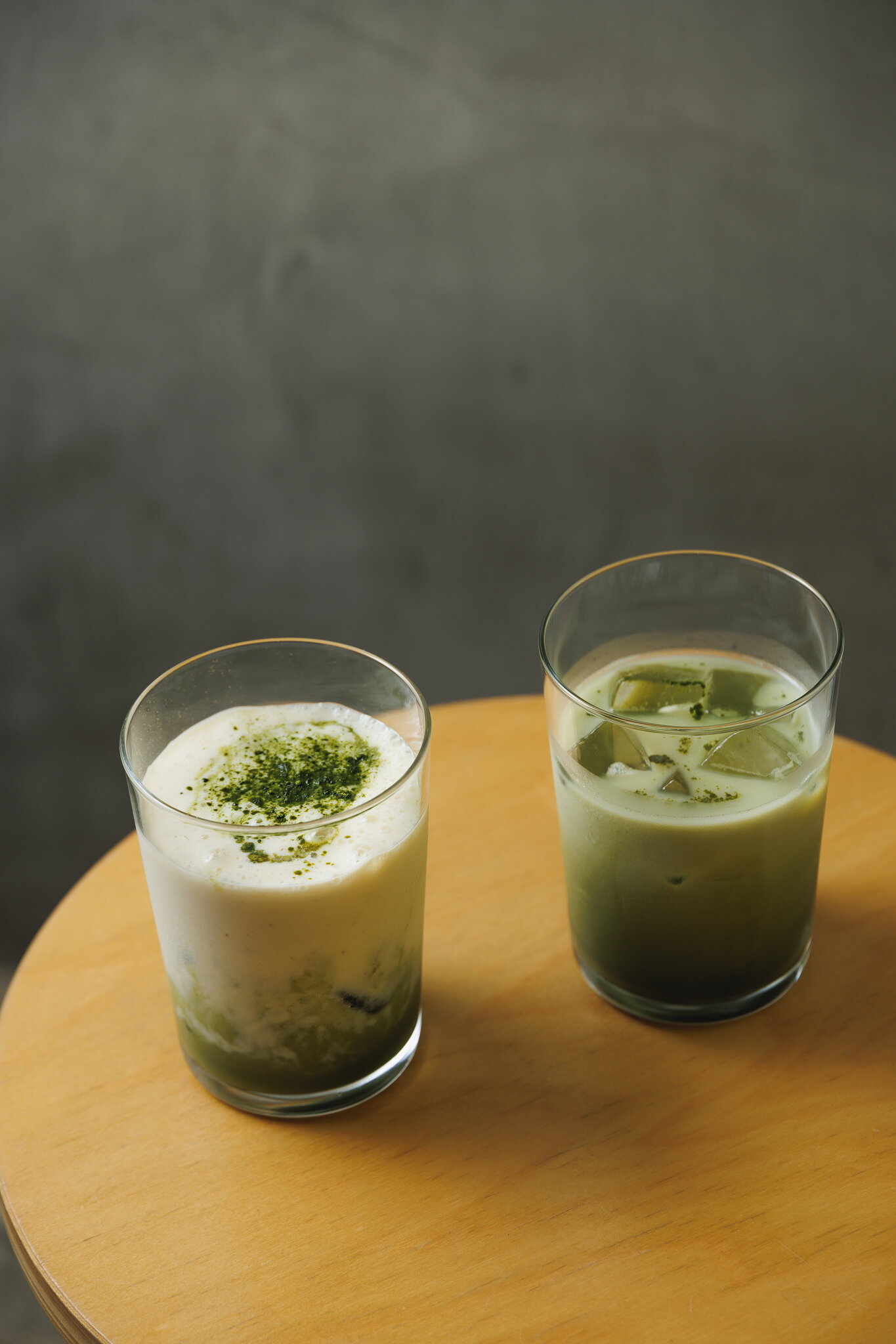Two matcha drinks side by side